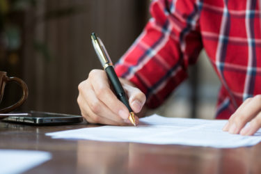 a policy holder putting information into his insurance documents